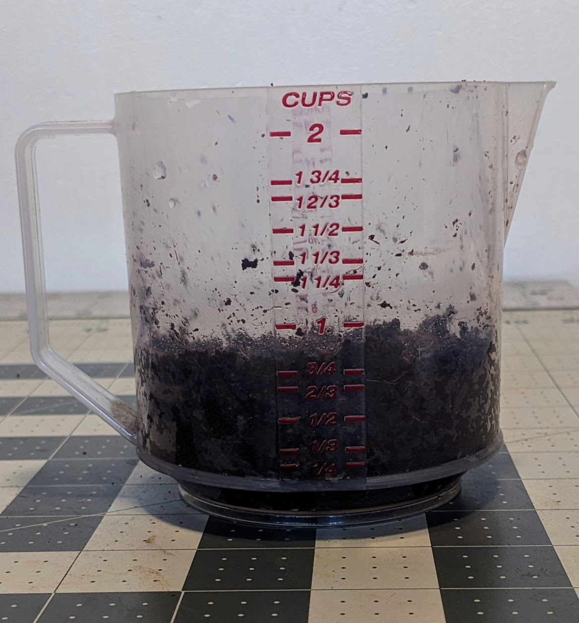 Soil in a clear measuring cup